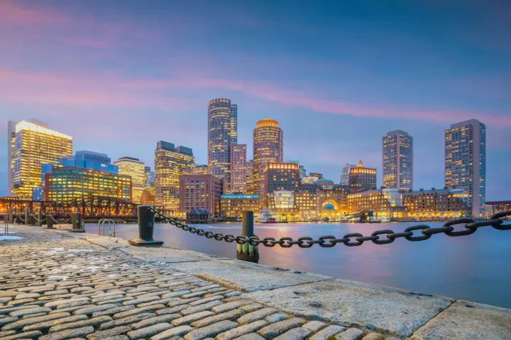 Sober travel tips Massachusetts. Boston skyline at sunset along the waterfront
